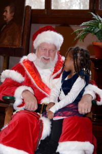 St. Nick talks to a young visitor